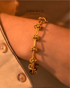 Golden Knot Link Bracelet — Bold Rectangular Knot Design